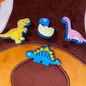 Four dinosaur croc charms
